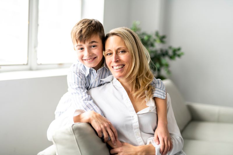 mother standing with her young son