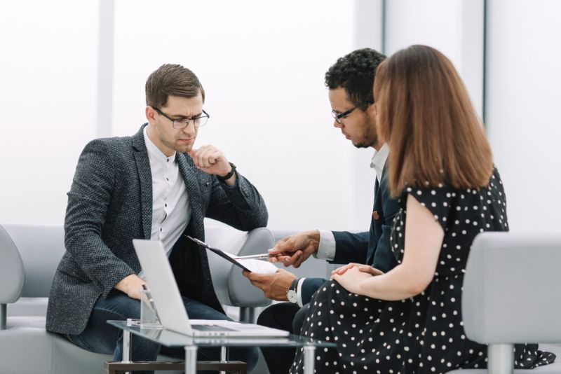 couple looking over paperwork with an attorney