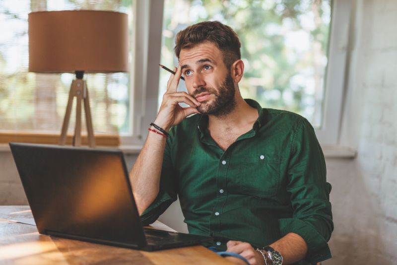 Disgruntled man working at home